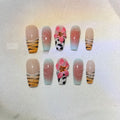 Set of false nails with zebra stripe, lily flower, and leopard print hand carving designs in long, wear-resistant style.