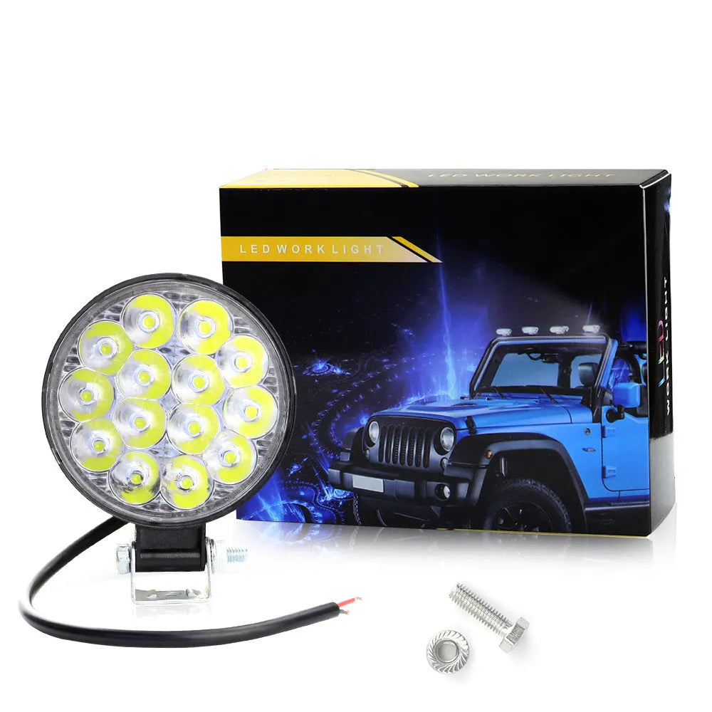 White mini round aluminium LED work light for car, truck, or boat with 42W power and IP67 rating.