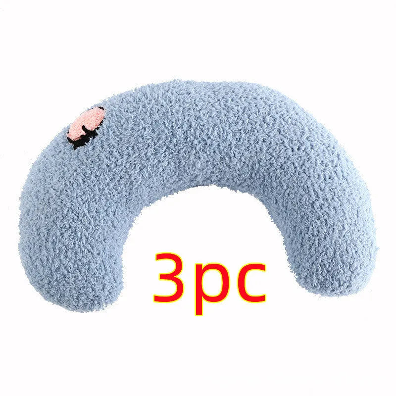 Small half-donut shaped plush pet pillow in blue, showing U-shaped design for cat or small dog neck support.
