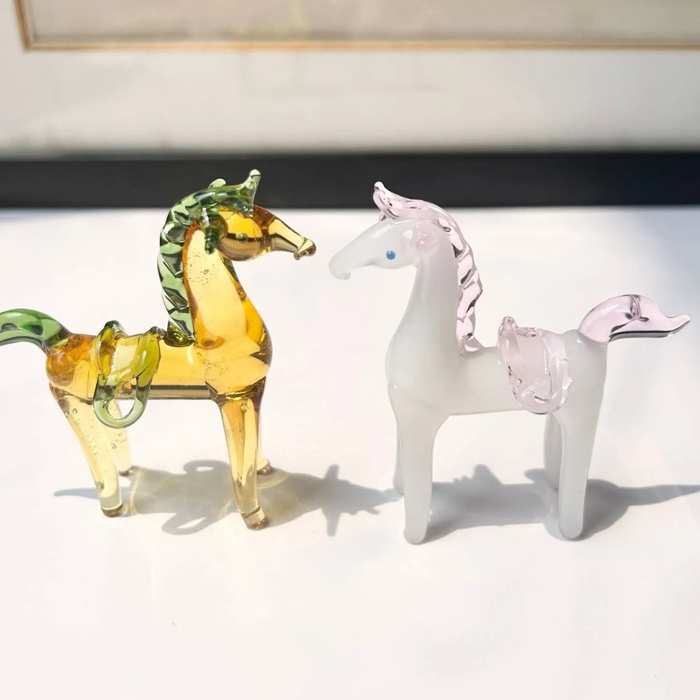 Glazed brown horse figurine on wooden desk as office decoration