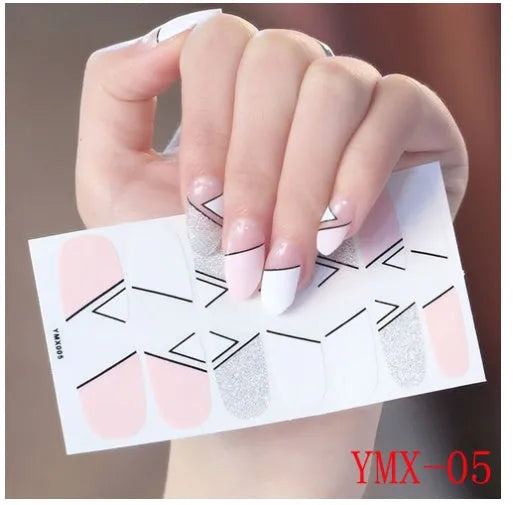 Full nail stickers set of 14 sheets showing 16 colour options in a flat lay arrangement