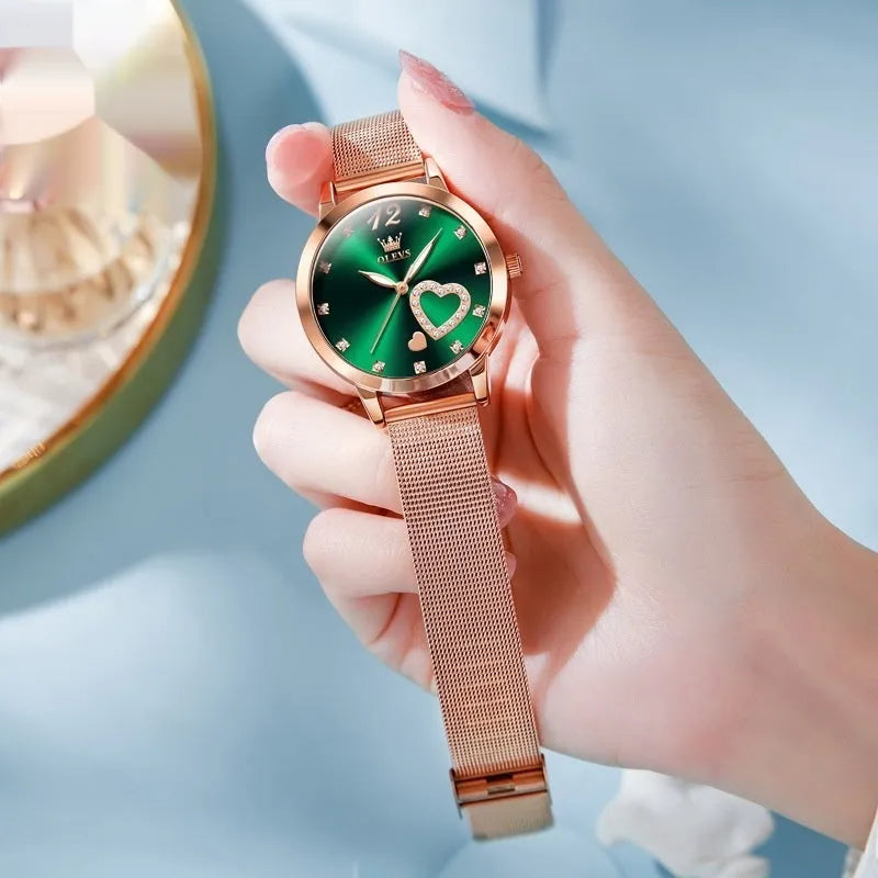 Women's rose shell case fashion watch with mesh strap, showing multiple dial colour options.