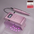 Silver battery nail polisher with stainless steel body, UV lamp, and six nail bits on a white background