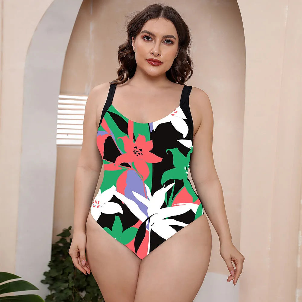 Floral print one-piece swimsuit with spaghetti straps and a conservative vest-style top.
