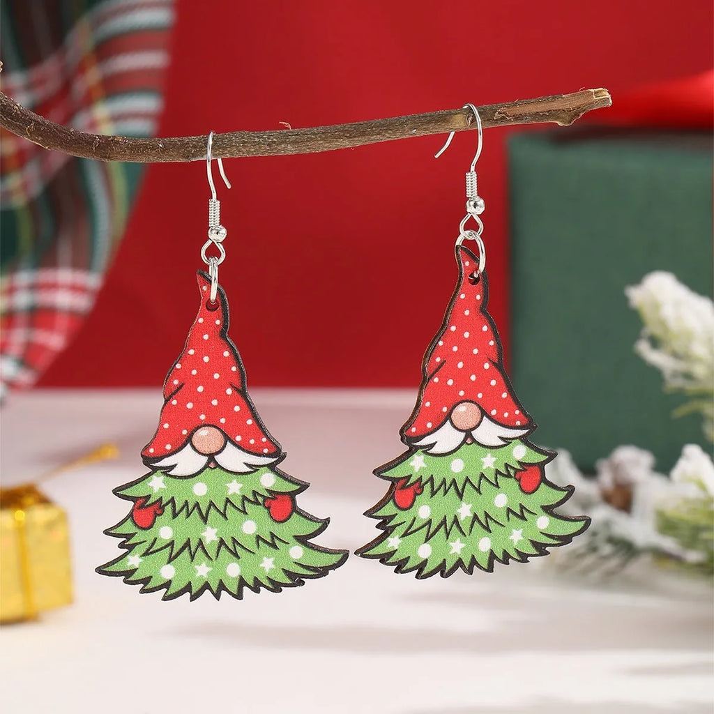 Wooden Christmas earrings with geometric tree and snowman designs featuring Santa Claus elements