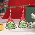 Wooden Christmas earrings with geometric tree and snowman designs featuring Santa Claus elements