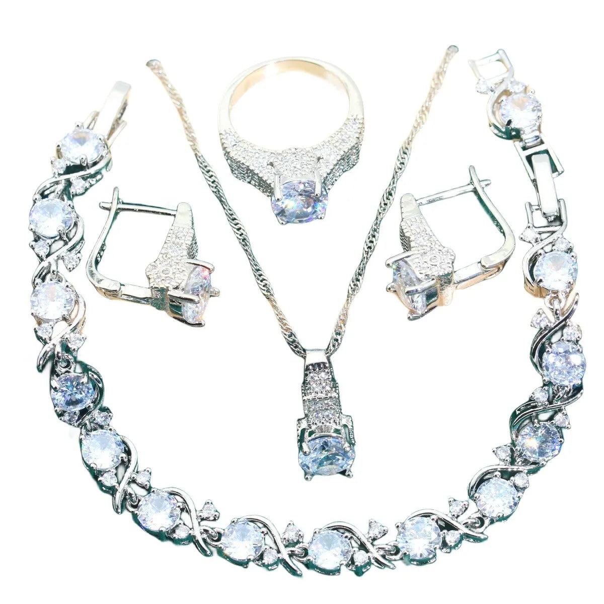 Four-piece bridal jewellery set showing zirconium alloy necklace, earrings, ring, and bracelet in water wave chain design.