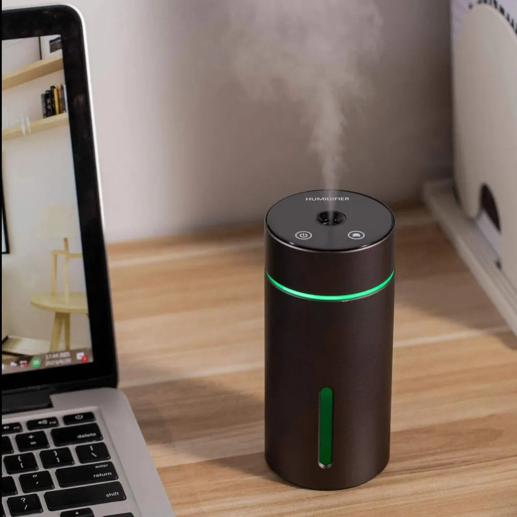 Aluminium car and desktop humidifier diffuser with 260ml tank and colourful LED light on black background.