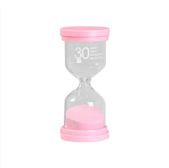 Handmade glass sand timer hourglass in blue on a plain background.