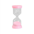 Handmade glass sand timer hourglass in blue on a plain background.