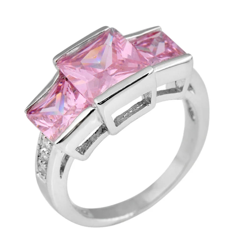 Geometric copper women's ring in champagne colour on a size no.8 finger, showing metal band and electroplated finish.