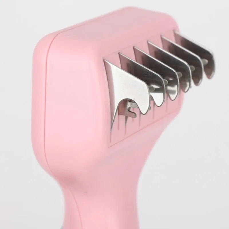Pink stainless steel dog comb and brush tool with a knot knife edge for pet grooming.