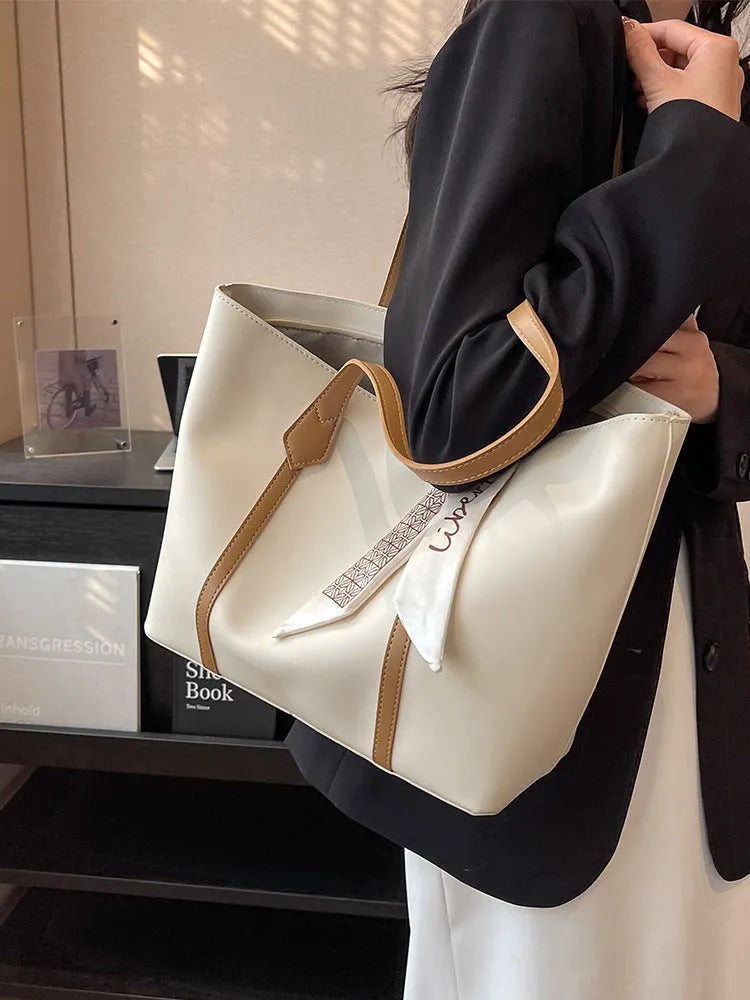 Canvas bucket tote bag with crossbody strap showing sandwich pocket organisation and soft construction