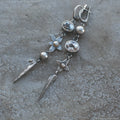 Geometric antique silver pendant earrings with XINGX design and rhinestone accents