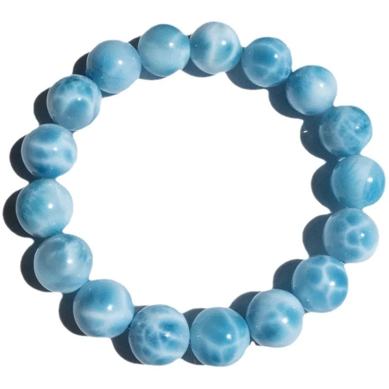 Blue bodhi bracelet with natural crystal sea-pattern stone and pearl accents in Maillard style arrangement