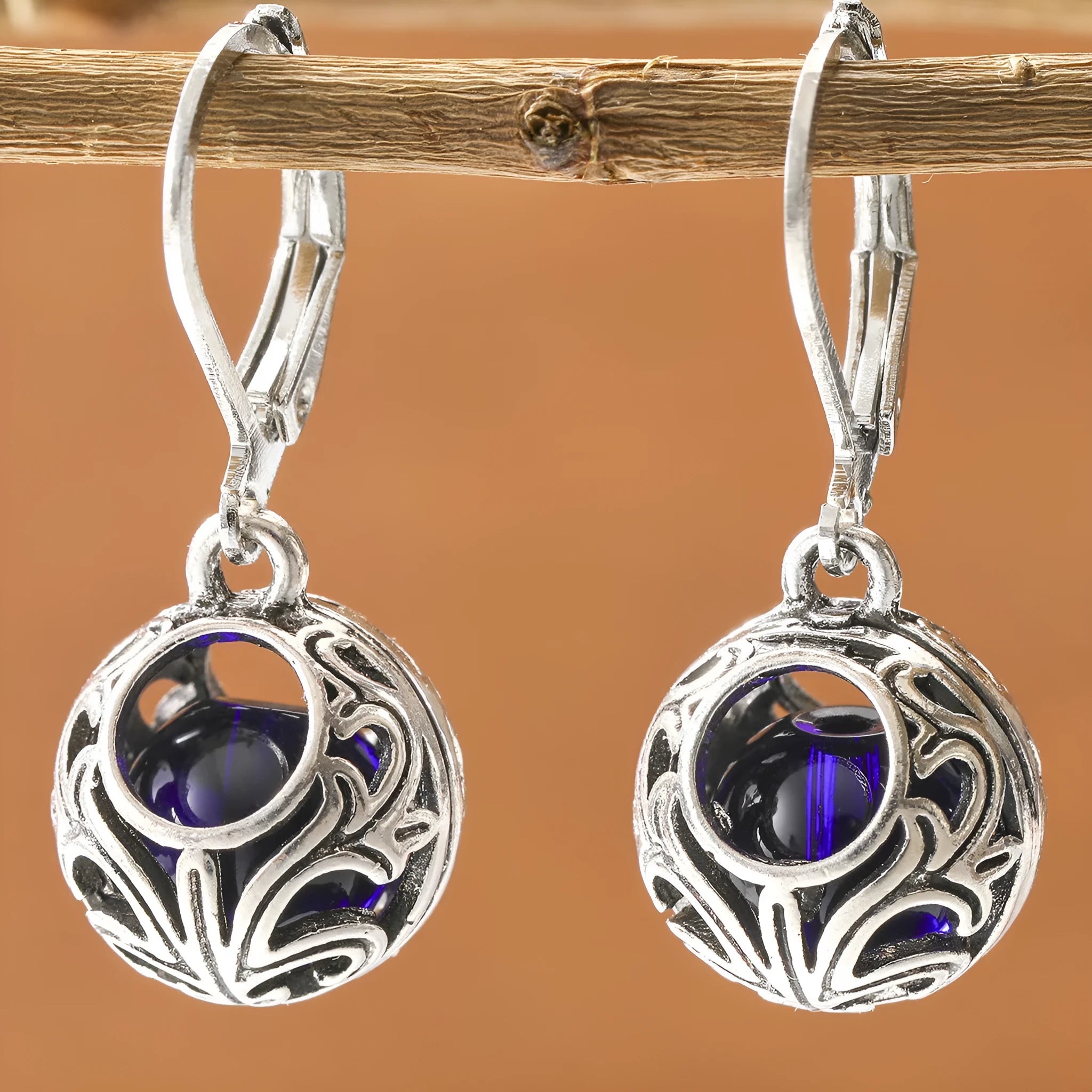 Silver geometric vintage engraving hollow drop earrings with blue gemstone centre