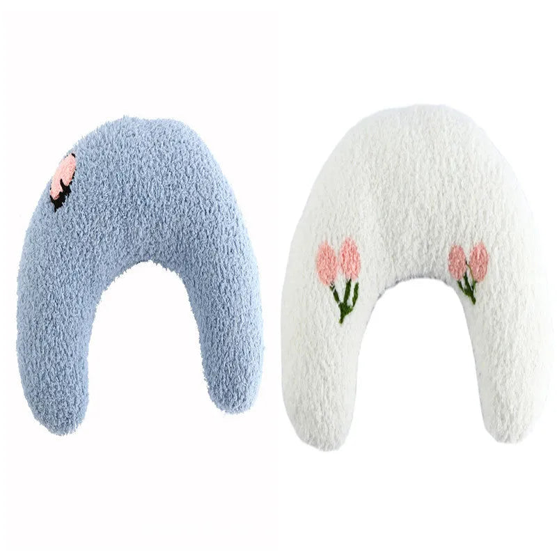 Small half-donut shaped plush pet pillow in blue, showing U-shaped design for cat or small dog neck support.