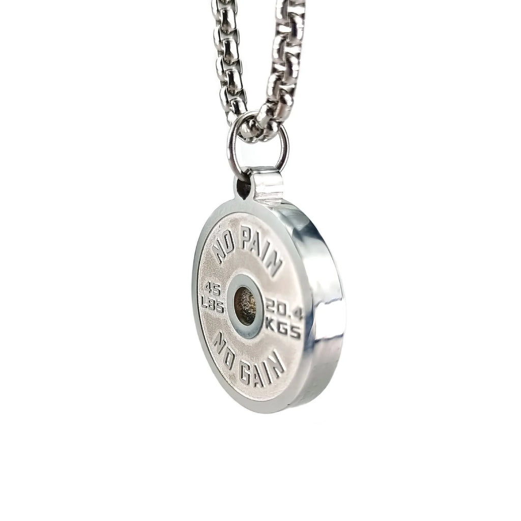 Polished stainless steel geometric barbell disk pendant on a choice of 60cm chains: black, gold, or pearl.