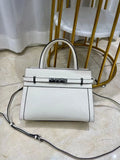 Genuine leather small square shoulder bag in almond green showing external pocket and stitching detail.