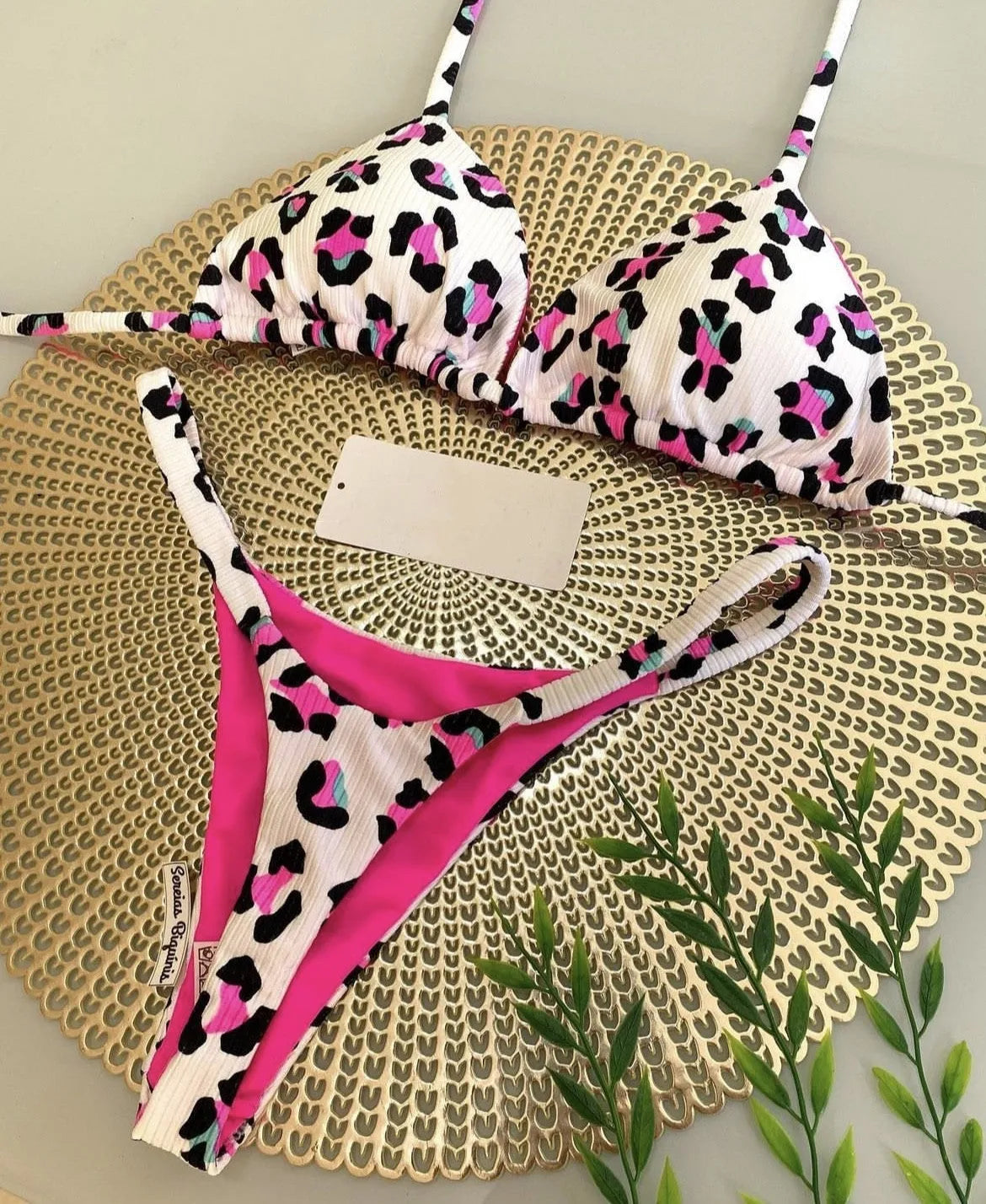 Women's printed bikini swimsuit with briefs style on a neutral background.