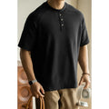 Casual loose top with raglan sleeves in terry texture fabric available in smoky grey, white, and black colours