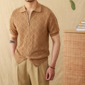 Light brown cotton short sleeve cardigan with zip front and lapel collar laid flat.