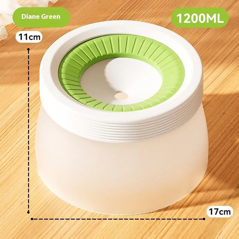 Green raised suspension water bowl for a dog on a white plate