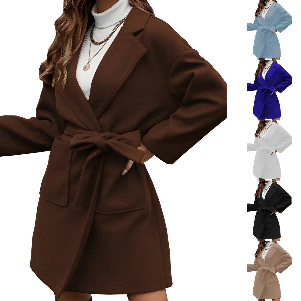 Long sleeve loose fit lapel coat with button front, split hem, and self-tie belt in thick polyester fabric.