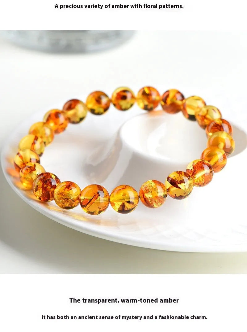 Natural yellow piebald amber bracelet with polished geometry beads and flower spot patterns