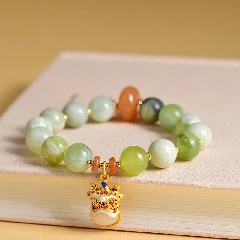 Green milk-in-water Xingshi jade geometric pendant on an adjustable string bracelet