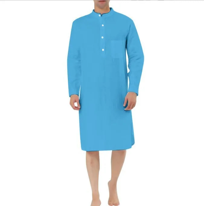 Man wearing a light blue cotton shirt-style robe with front pockets, showcasing casual loungewear.