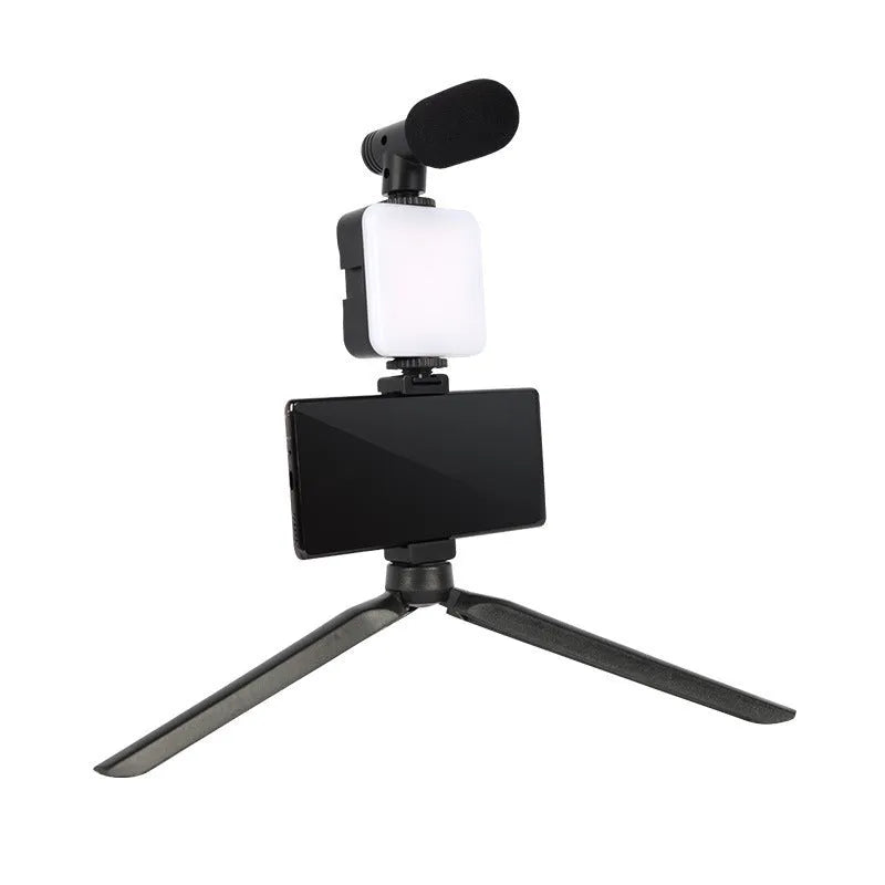 Universal LED mini square camera flash with rotatable head on a tripod stand.