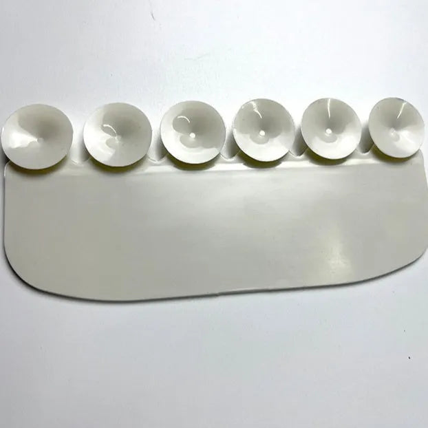 White PVC toilet training splash guard for children placed on toilet seat