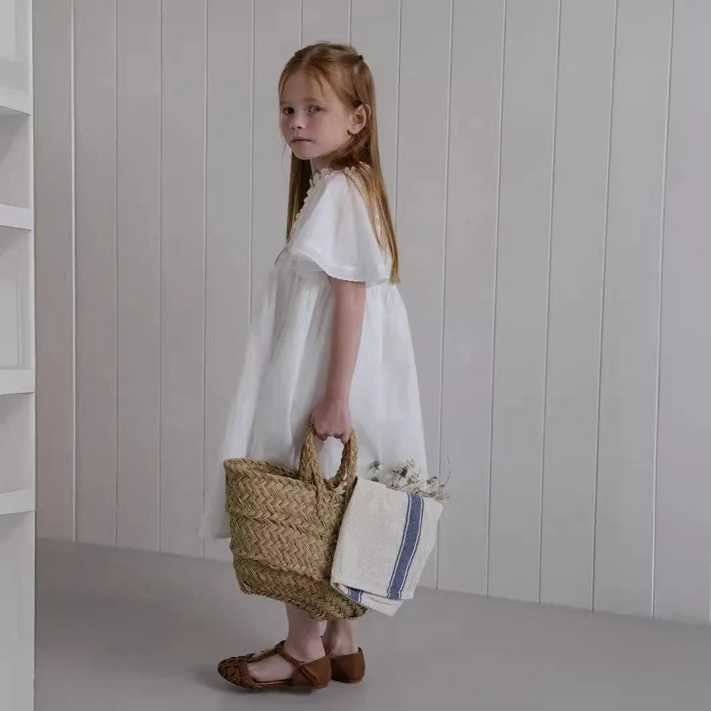 White washed cotton girls dress with short sleeves, ruffled and embroidered skirt for summer