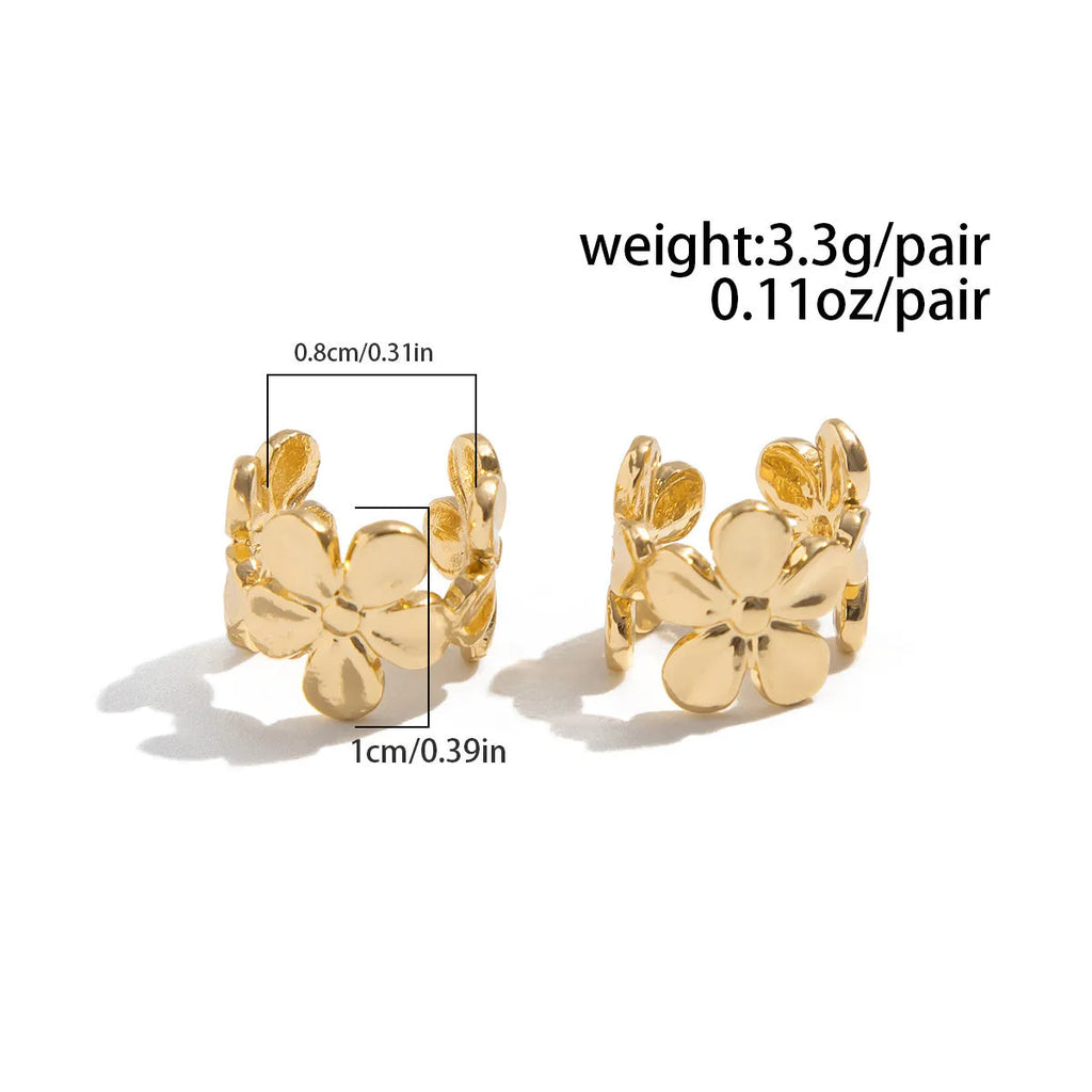 Gold-coloured starfish and scallop shell dangle earrings for women on a white background.
