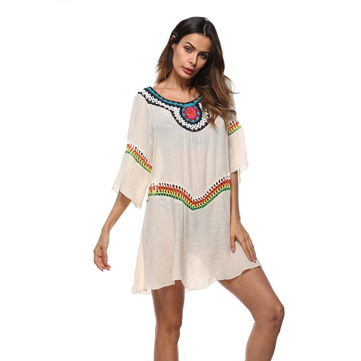 Women's crocheted ethnic style sun protection clothing in apricot colour with beach background