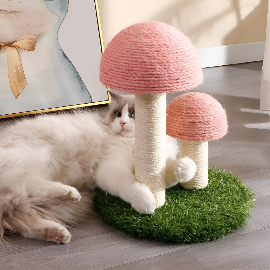 Pink mushroom-shaped cat scratching post with sisal caps and pole for small cats.