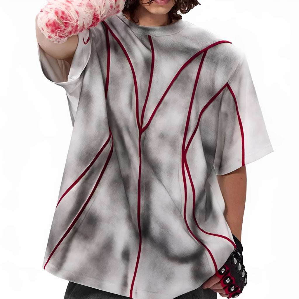 Short sleeve t-shirt with padded shoulders and raised line patchwork design on a round neck.