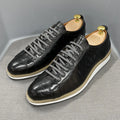 Men's low-top handmade casual shoes with an embossed pattern and front lace closure.