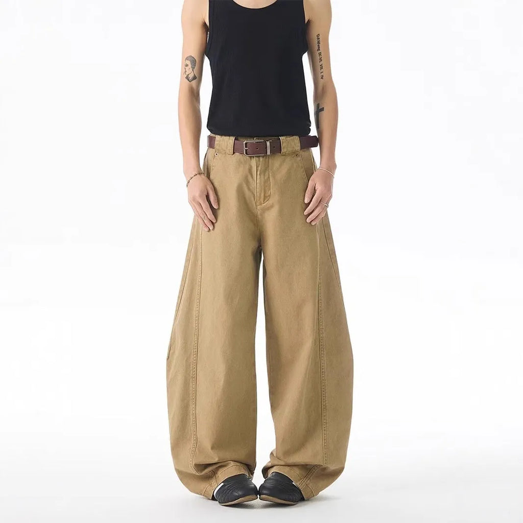 Brown men's loose fit straight leg denim jeans with a button fly, shown laid flat.