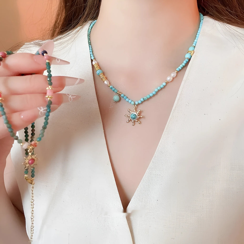 Freshwater pearl sun necklace on clavicle chain in court style, blue-sun colour option.