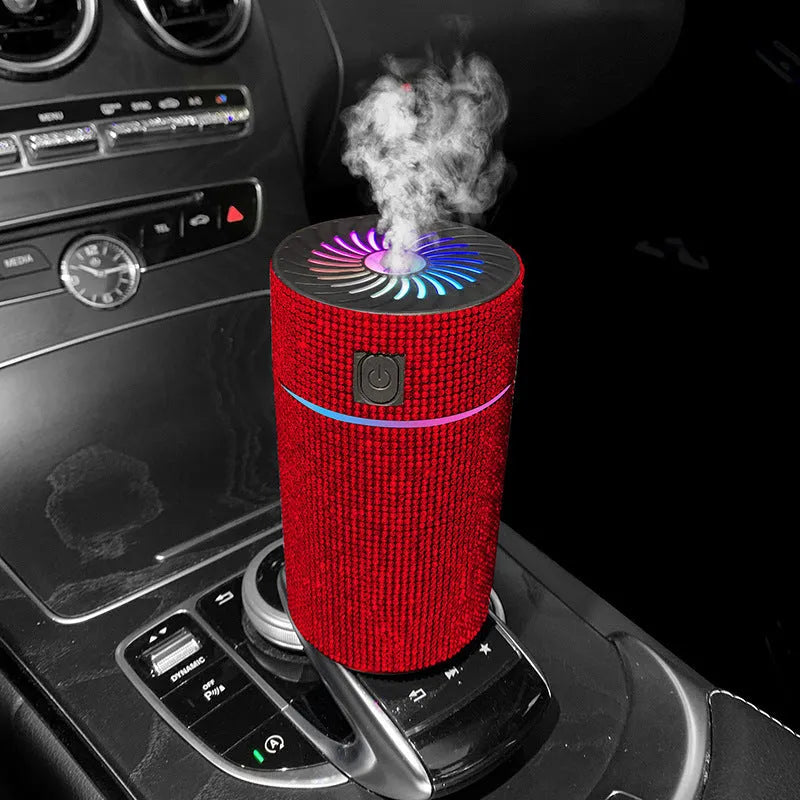 Compact white car air humidifier and purifier with USB cable on a car dashboard