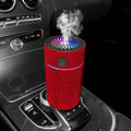 Compact white car air humidifier and purifier with USB cable on a car dashboard