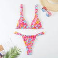 Women's floral print bikini swimsuit in blue, rose red, sky blue, or white colour.
