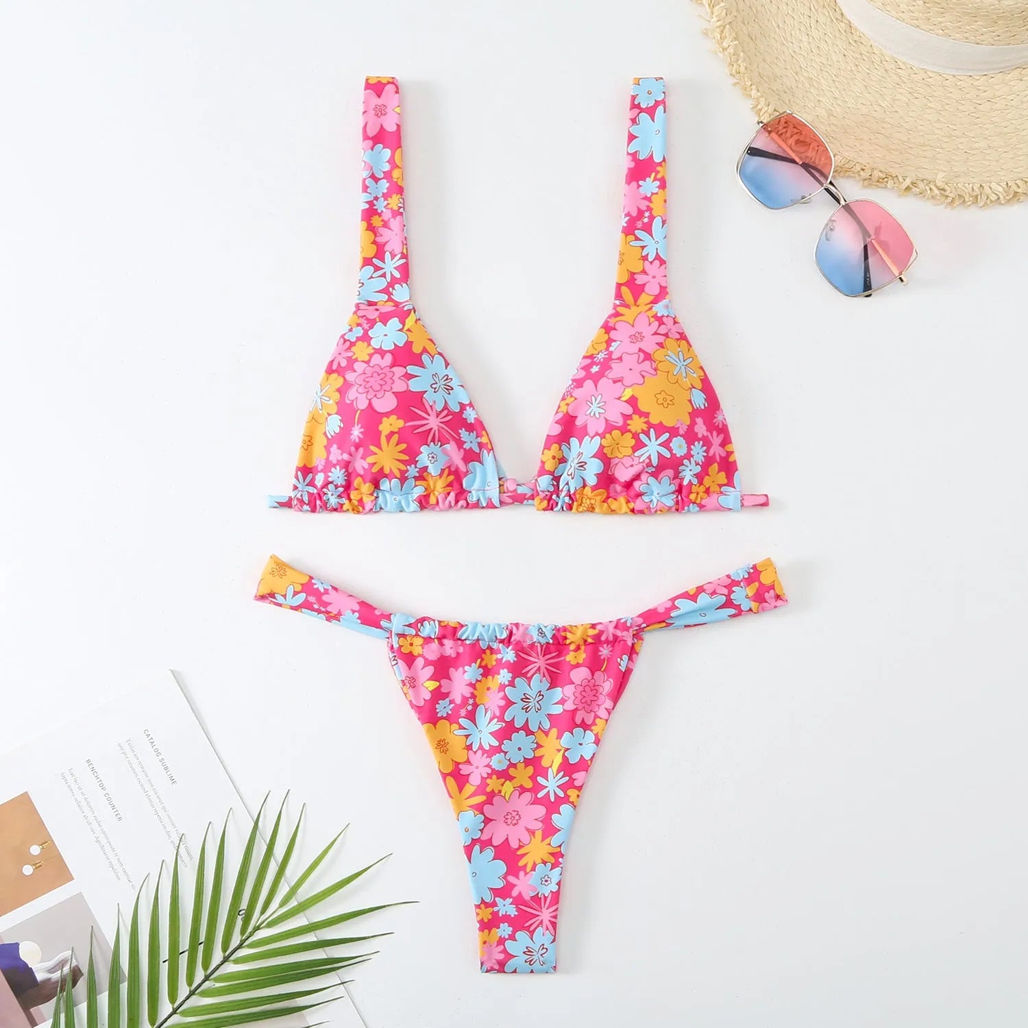 Women's floral print bikini swimsuit in blue, rose red, sky blue, or white colour.