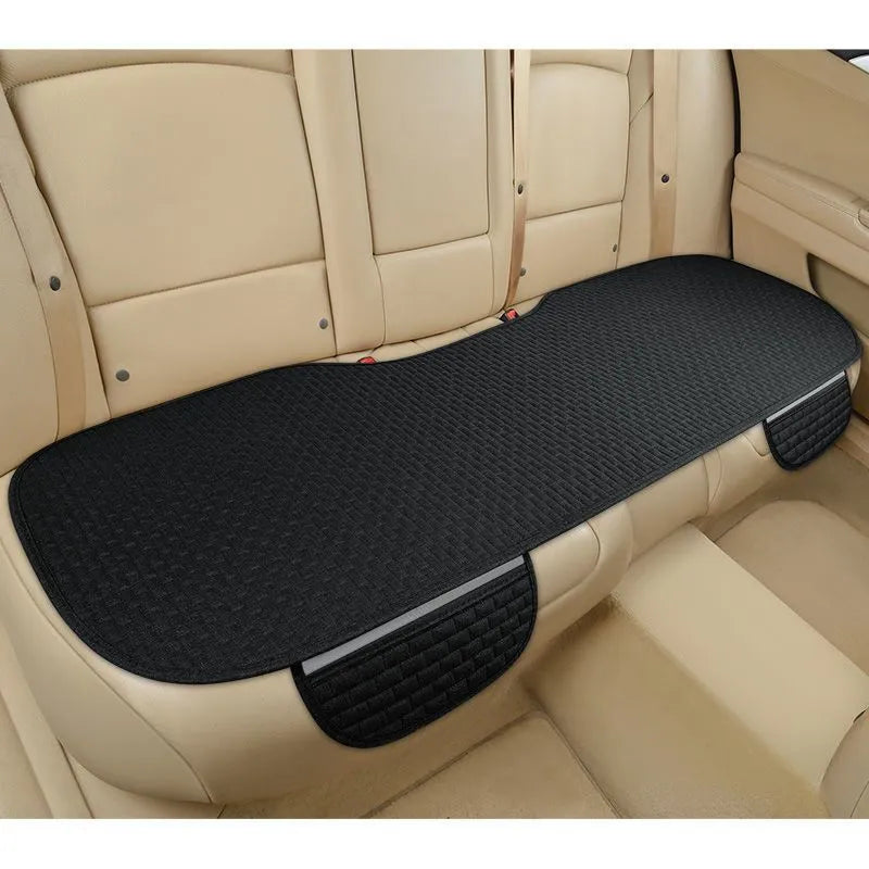 Linen car seat cushion with plaid design available in single seat or three-piece set configurations