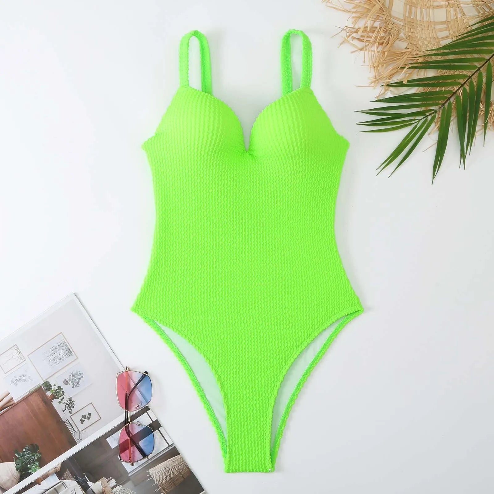 Women's black sunk stripe one-piece swimsuit made from polyester, shown on a mannequin.