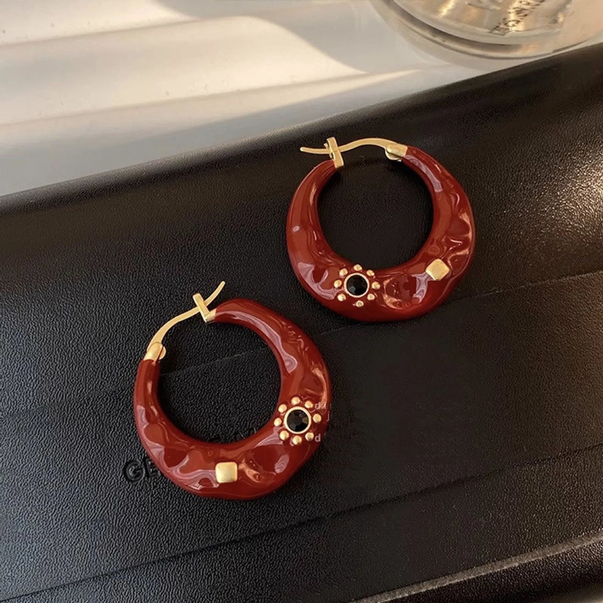 Hong Kong style retro ear studs with rhinestone decoration and dripping oil finish in black and red colour options