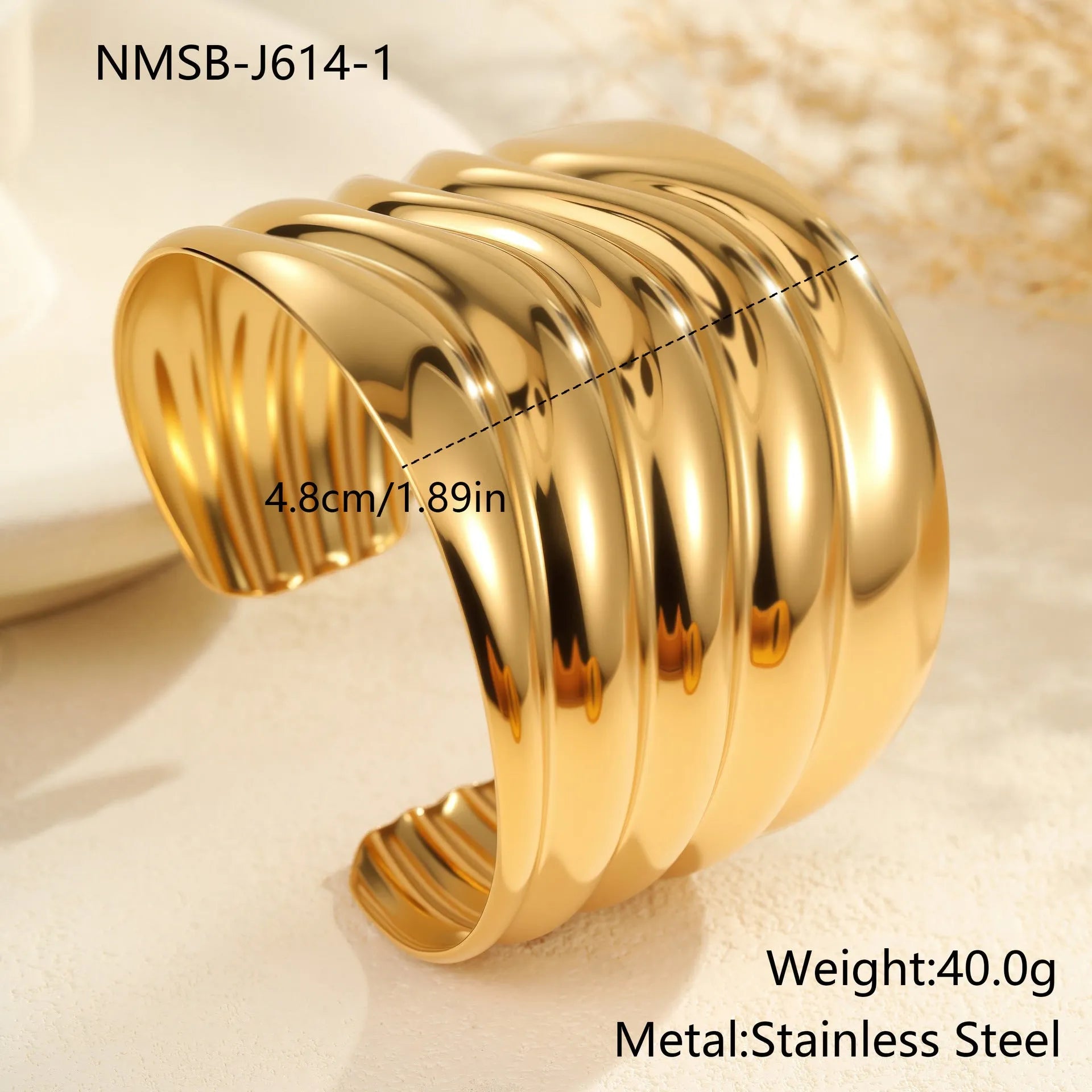 Women's gold-plated wide bracelet with stainless steel construction and geometric design