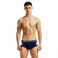 Men's low-waist cotton boxer shorts in dark blue, shown flat.